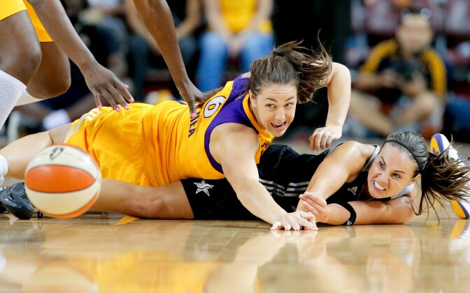 The WNBA's Becky Hammon battling the LA Spark's Jenna O'Hea. This week Hammon was named the new assistant coach for the NBA's San Antonio Spurs