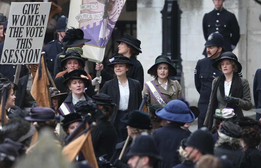 Actors (L-R) Anne-Marie Duff, Carey Mulligan, Helena Bonham Carter and Romola Garai take part in filming of the movie Suffragette at Parliament on April 11, 2014 in London, England.