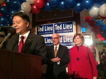 Ted Lieu speaks at his election night party with the Waxmans accompanying him on stage.