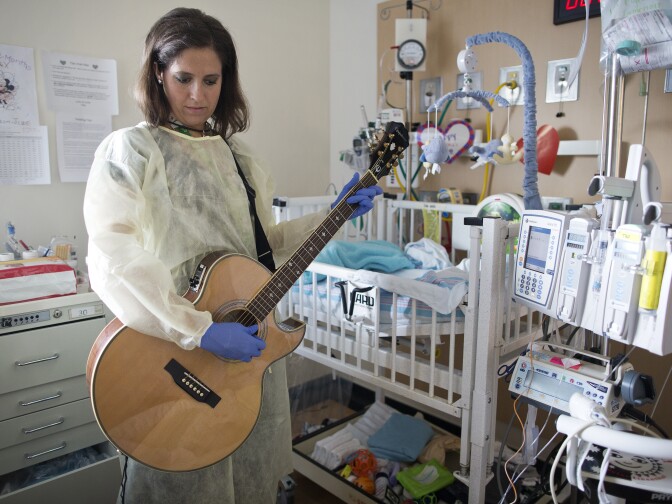 Tacy Pillow is a music therapist at Children's Hospital Los Angeles. In addition to inpatient visits, Pillow has played guitar during routine procedures and surgeries.