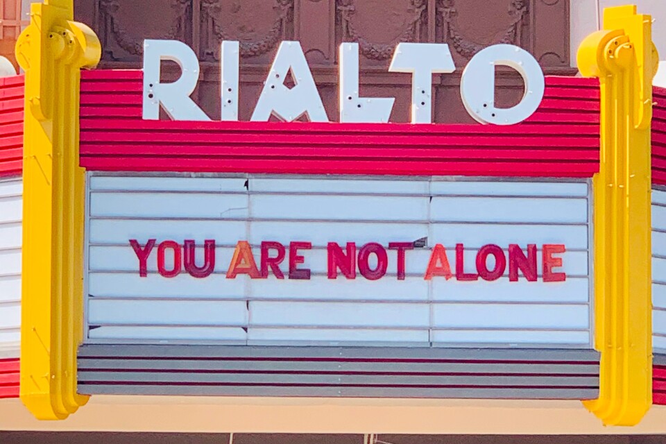 The Rialot marquee reads "You are not alone."