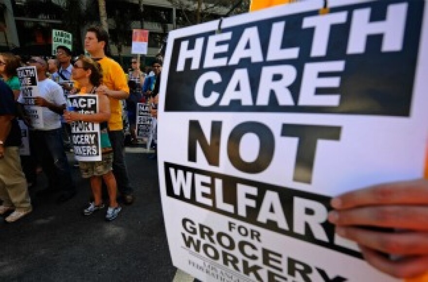 NAACP members join labor march in support of grocery workers.