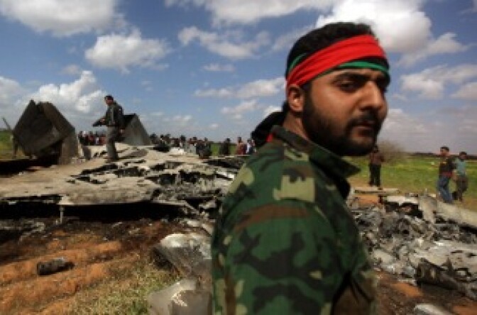 Libyans gather around the wreckage of a US F-15 fighter jet in Ghot Sultan, South-East of Benghazi.