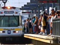 Passengers prepare to board a Long Beach-bound Metro Rail Blue Line train at Washington and Grand near downtown Los Angeles on Thursday, Sept. 14, 2000. With a strike deadline of 12:01 a.m. Friday, three unions representing Metropolitan Transit Authority drivers, mechanics and clerks were still negotiating with the agency Thursday afternoon, trying to avert a shutdown of about 200 bus and three rail routes, inconveniencing an estimated 450,000 daily riders. (AP Photo/Reed Saxon)
