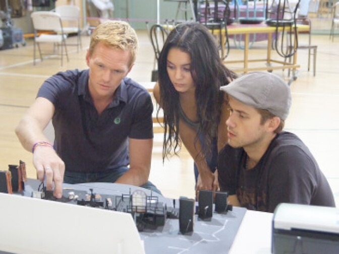Director Neil Patrick Harris with Vanessa Hudgens as Mimi and Aaron Tveit as Roger in rehearsal for "RENT" at the Hollywood Bowl August 6-8. 
