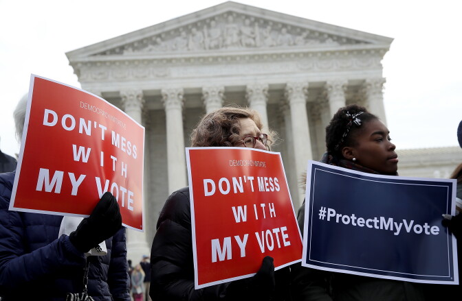 WASHINGTON, DC - JANUARY 09:  Protesters gather during a rally held by the group Common Cause in front of the U.S. Supreme Court January 10, 2018 in Washington, DC. Voting rights activists rallied to oppose voter roll purges as the Supreme Court hears oral arguments in the Husted v. A Philip Randolph Institute, a challenge to Ohio's voter roll purges. (Photo by Win McNamee/Getty Images)