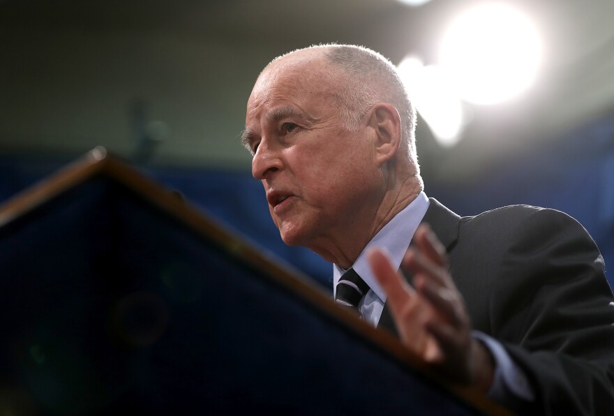 File: California Gov. Jerry Brown speaks to reporters during a news conference where he revealed his revised California State budget on May 11, 2017 in Sacramento.