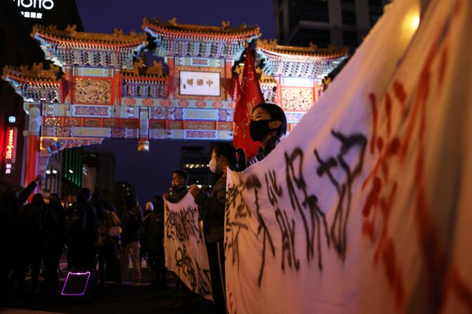WASHINGTON, DC - MARCH 17: Activists participate in a vigil in response to the Atlanta spa shootings March 17, 2021 in the Chinatown area of Washington, DC. A gunman opened fire in three spas in the Atlanta, Georgia area, the day before killing eight people, including six women of Asian descent. (Photo by Alex Wong/Getty Images)