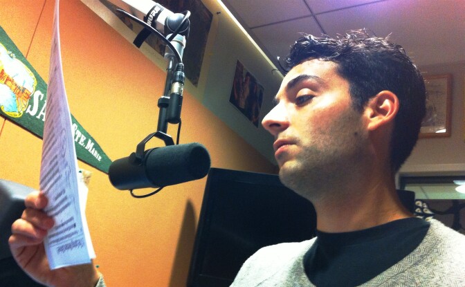 LA Weekly staff writer Hillel Aron reading his script in the Off-Ramp studio.