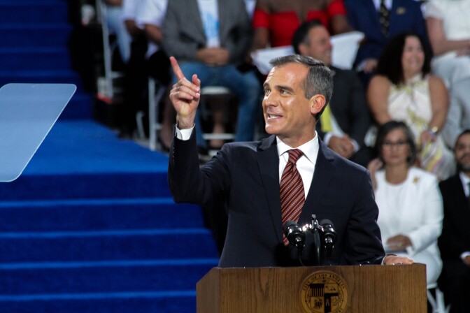 Mayor Eric Garcetti takes to the podium at his inauguration at City Hall in Los Angeles, California on July 1, 2017.