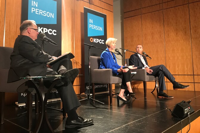 Candidates Janice Hahn and Steve Napolitano on stage with KPCC's Larry Mantle (far left) during an AirTalk debate in Cerritos for the Los Angeles County Board of Supervisors District 4 seat.
