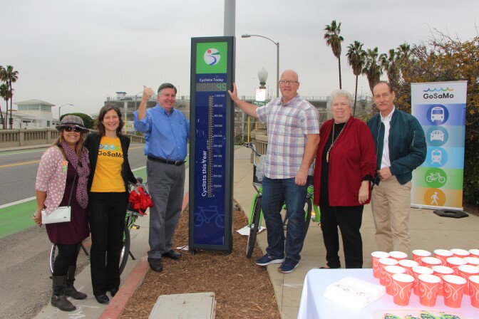 Santa Monica city officials show off the new bike counter on Main Street on December 21, 2016.
