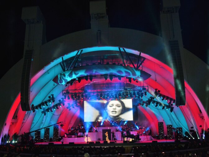 Vintage photos of Googoosh were projected at her Hollywood Bowl performance.