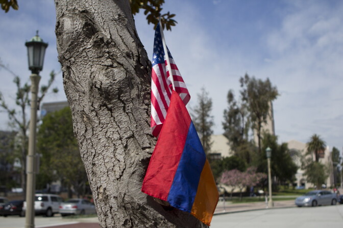 An American and Armenian flag rest together against a tree. Many of the speeches focused on the role of Armenia and America together in increasing recognition of the genocide.