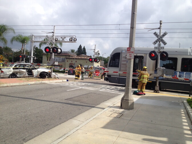 A Metro train collided with a Toyota Corolla Sunday, briefly shutting down service on the Gold Line. 