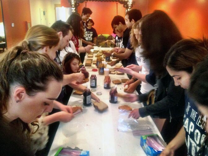UCI students at the Center for Living Peace in Irvine spent part of Saturday making sandwiches for homeless people in Orange County.