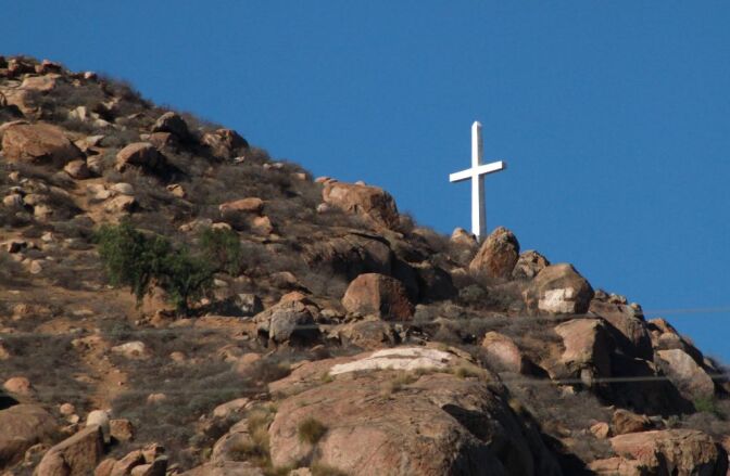 Erected over 50 years, the towering Christian cross atop Riverside’s Mount Rubidoux is now the target of a possible civil liberties lawsuit over separation of church and state.

