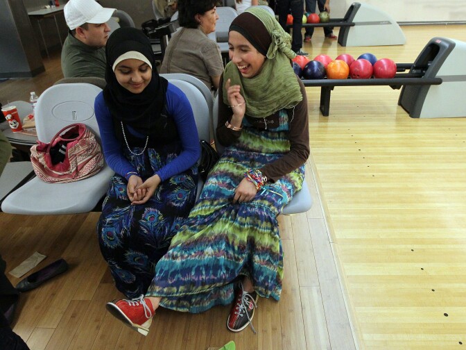 SAN FRANCISCO - NOVEMBER 27: Muslim teenagers Anfal Morsy (L) and Sara Bouabibsa look at their bowling shoes during a group outing at the Yerba Buena Bowling Center November 27, 2009 in San Francisco, California. Eight years after the September 11th terrorist attacks, Muslims in America are once again fearing a backlash following last months Ft. Hood shootings. Muslim groups have started to organize campaigns to educate the public about Islam and its adherents. 