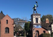 A brick building with a sign, "The Jim Henson Company" out front. And a frog on top of it.