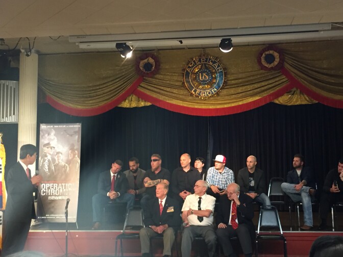 Veterans of the post-9/11 wars sit behind three veterans of the Korean War for a Q&A session following the screening of 'Operation Chromite' - a new movie about the 1950 lncheon Landing.