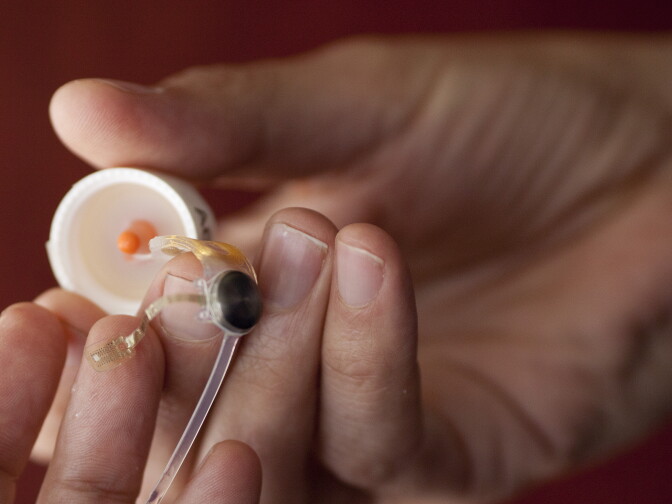 Dr. James Weiland shows of an Argus II prosthetic retina at the USC Eye Institute. Dr. Weiland worked with Dr. Mark Humayun to develop the device, which uses electrical stimulation to help a patient with degenerative eye diseases to differentiate between light and shadows.