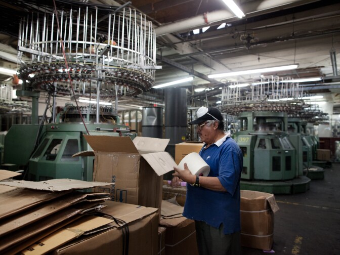 Threading machines weave fabric at the Antex Corporation warehouse, which owns Youth Monument. All the company's clothing is knit, dyed and finished on the premises.