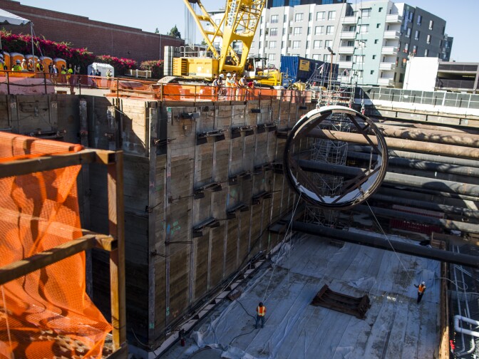A segment of a tunnel boring machine is lowered into the Regional Connector Transit Project in Little Tokyo on Wednesday morning, Oct. 29, 2016. The machine will dig twin 1.1-mile rail tunnels.