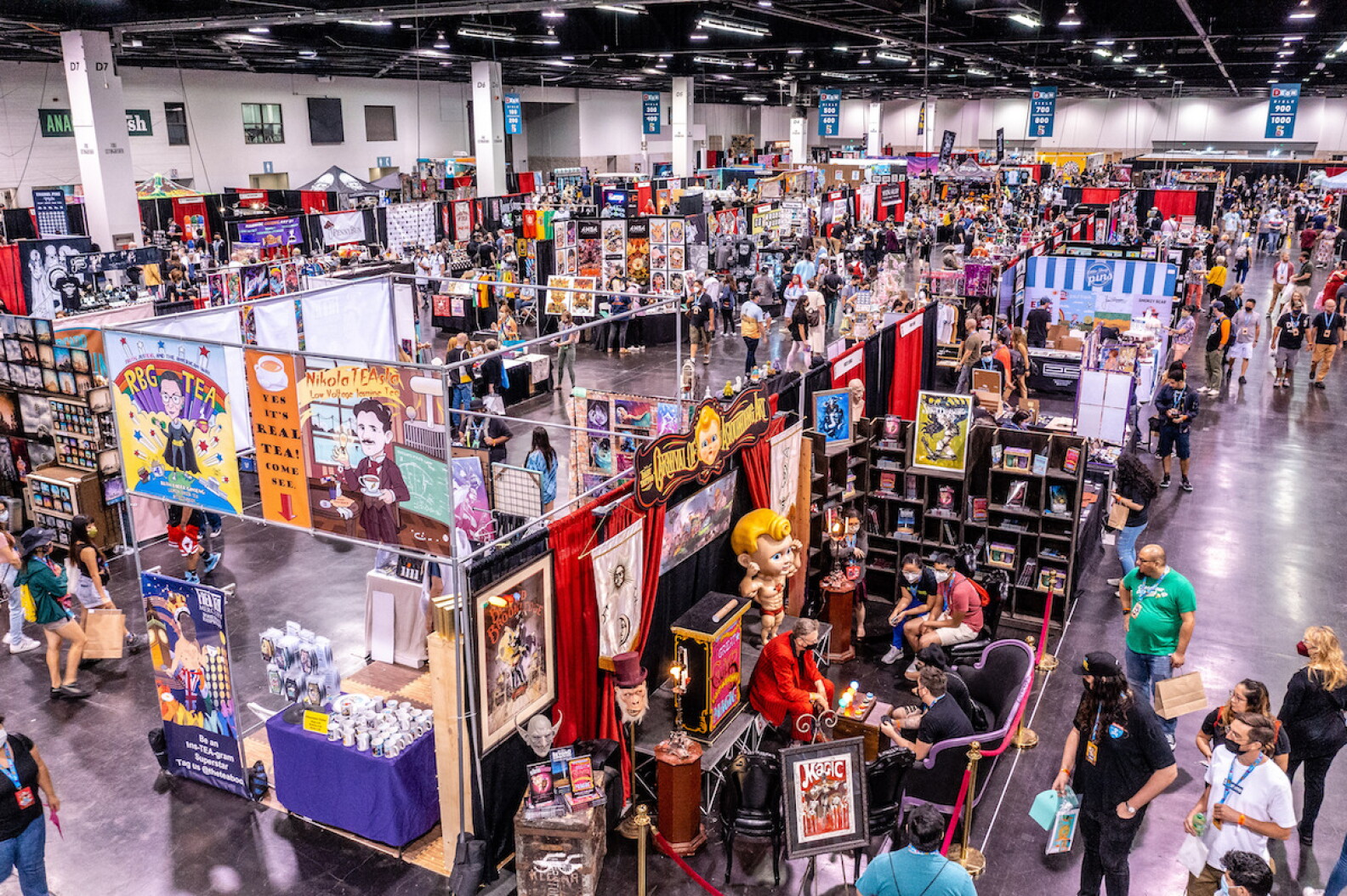 Holiday shoppers stroll through extravagant displays filled with apparel and art at the Anaheim Convention Center.