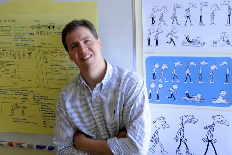 FILE - In this March 1, 2011 file photograph, Jeff Kinney, author of the children's book series, "Diary of a Wimpy Kid," poses for a portrait at his office in Boston. Kinney's book sold 1 million copies in its first week, all on paper. (AP Photo/Gretchen Ertl, File)