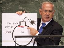 Technicians upgrading Iran's main uranium enrichment facility have tripled their installations of high-tech machines that could be used in a nuclear weapons program to more than 600 in the last three months, diplomats said Wednesday. (Benjamin Netanyahu, Prime Minister of Israel, uses a diagram of a bomb to describe Iran's nuclear program while delivering his address to the United Nations in September 2012).  