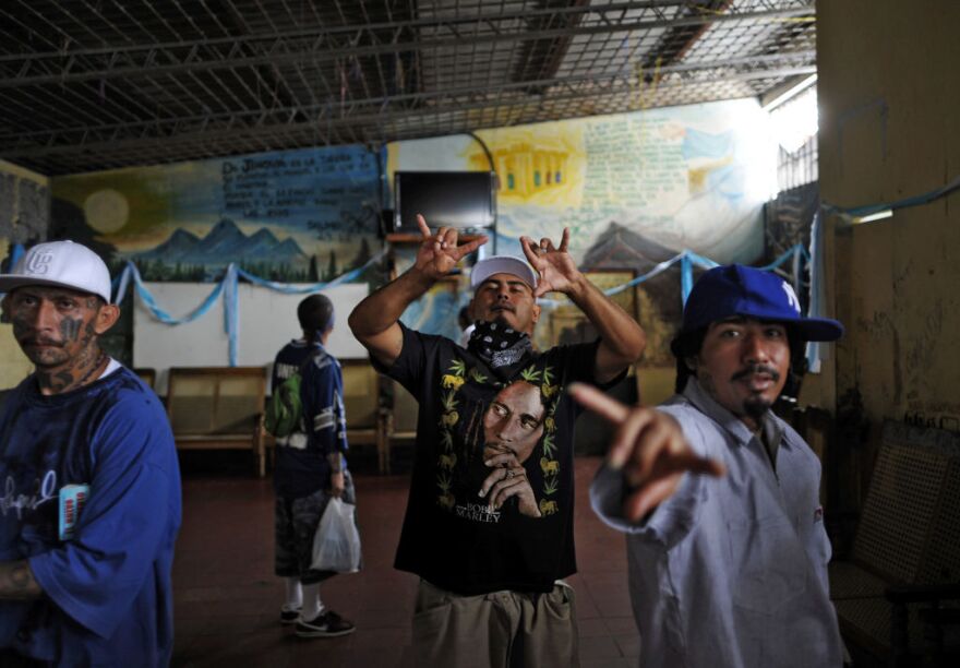 Mara Salvatrucha gang members remain at the prison of Ciudad Barrios, 160 km east of San Salvador, El Salvador on June 19, 2012. Inmates participated in a mass to celebrate 100 days after a truce was declared between gangs and the Salvadorean goverment.