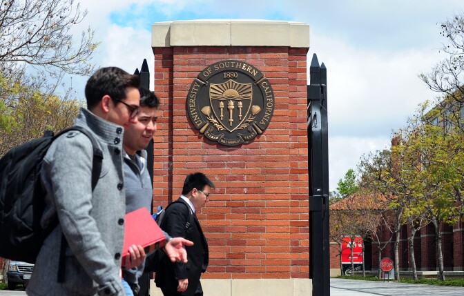 File: Students walk past an entrance to the University of Southern California in Los Angeles on April 11, 2012 in California. 