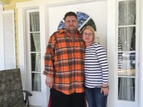 Matt Fairchild and his wife, Ginger, stand in front of his Burbank home.