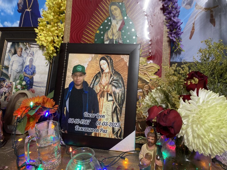 An altar prepared for 35-year-old Oscar Leon Sanchez, who was fatally shot by an LAPD officer. Fresh flowers sat atop a gold tablecloth and candles burned all around. In the center, a picture of Leon Sanchez leaned up against a larger print of Our Lady of Guadalupe.