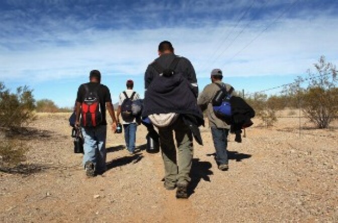 Undocumented Mexican immigrants walk through the Sonoran Desert after illegally crossing the U.S.-Mexico border