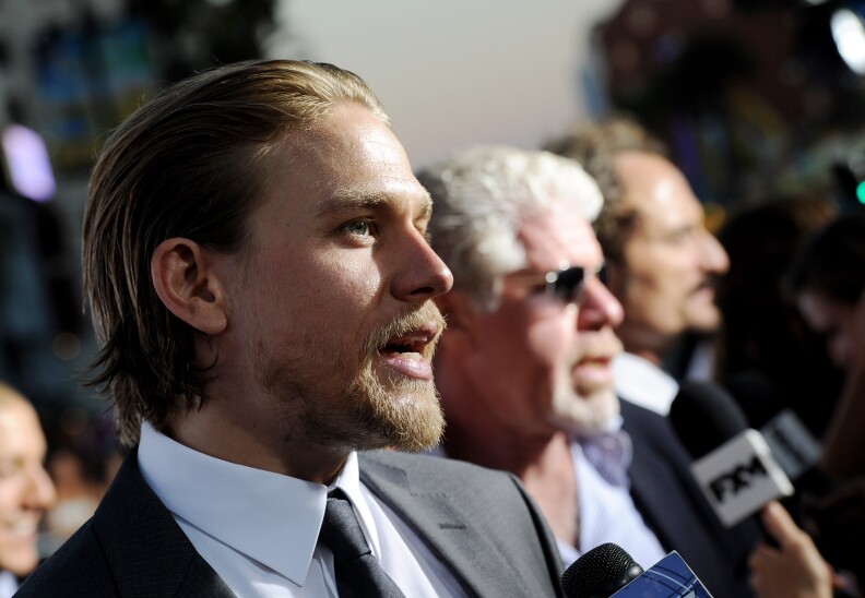 LOS ANGELES, CA - SEPTEMBER 07:  (L-R) Actors Charlie Hunnam, Ron Perlman and Kim Coates arrive at the premiere of FX's "Sons of Anarchy" Season 6 at the Dolby Theatre on September 7, 2013 in Los Angeles, California.  (Photo by Kevin Winter/Getty Images)