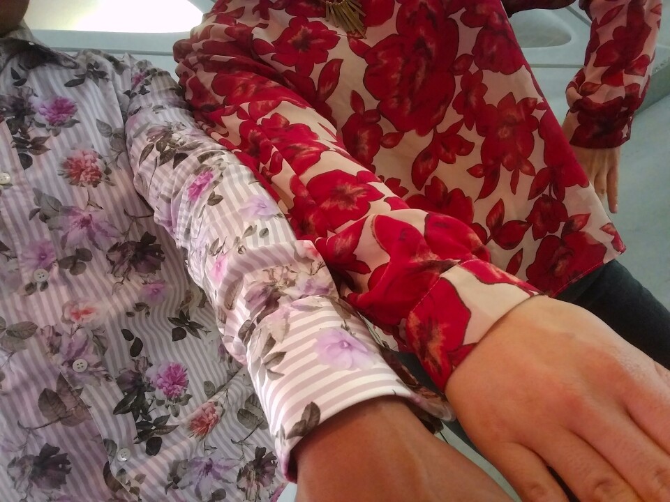 Wearing a colorful, patterned top is a good way to dress for a selfie inside one of the infinity rooms at the Broad Museum's Kusama retrospective. KPCC's Leo Duran (L) and Maya Sugarman both wore floral shirts.