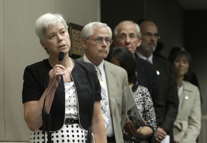 File: Amanda Wilcox, left, accompanied by her husband Nick Wilcox, second from left, whose daughter, Laura, was killed in a 2001 Nevada County shooting spree, joined others in calling on lawmakers to approve a bill aimed at abolishing capital punishment, at a hearing of the Assembly Public Safety Committee at the Capitol in Sacramento, Calif., Thursday, July 7, 2011.