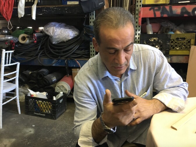 George Haratoonian dials his brother's family in Tehran. The Armenian Christian family was due to fly to Los Angeles on Feb. 4 through a refugee program for religious minorities. But their transit visas to Austria, the first leg of their journey, were canceled by the Austrian government just as the Trump administration's refugee ban was set to take effect. They are still waiting.