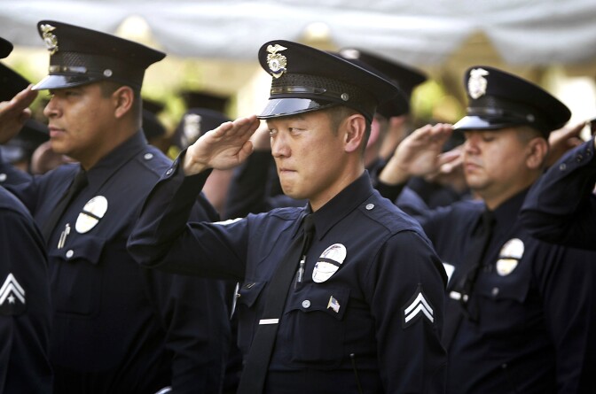 On May 3, 2003, Los Angeles Police Department (LAPD) officers salute during an LAPD ceremony to pay tribute to the 194 Los Angeles officers who have died since 1907. The annual ceremony, held during National Police Week, honors all fallen police personnel but gave special tribute to two who were killed this past year. 