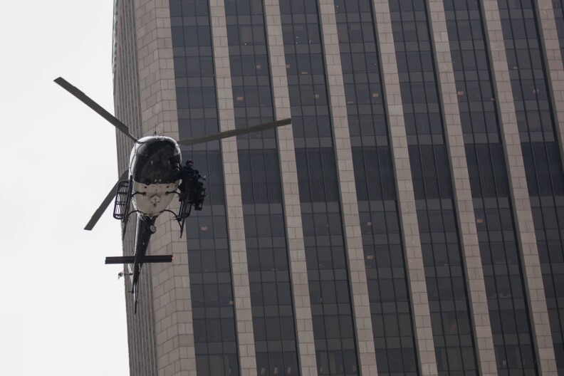 An LAPD helicopter flys low over Figueroa Street during a counter-terrorism demonstration in Downtown.