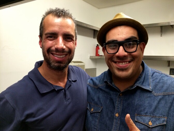 A Martinez and Chef Aaron J. Perez pose inside Vaka's tiny kitchen.