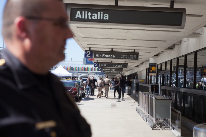 Police officers at Terminal 2 at LAX on November 1st, 2013, the day a gunman entered the airport and opened fire, killing a TSA officer and wounding others.