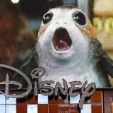 NEW YORK, NY - DECEMBER 14: An advertisement of the new Star Wars film plays on a screen as the Disney logo is displayed outside the Disney Store in Times Square, December 14, 2017 in New York City. The Walt Disney Company announced on Thursday morning that it had reached a deal to purchase most of the assets of 21st Century Fox. The deal has a total value of around $66 billion, with Disney assuming $13.7 billion of Fox's net debt. (Photo by Drew Angerer/Getty Images)