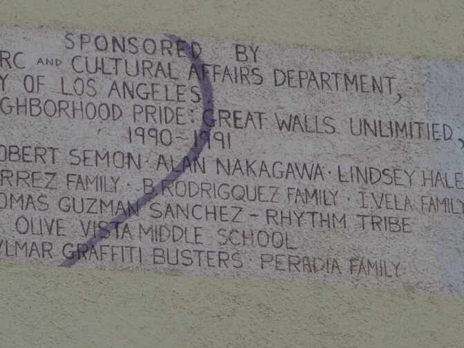 The large mural on the Olive Vista Middle School's multipurpose room carries a painted list of those who contributed to the massive artwork. The building is to be torn down and replaced by 2019.