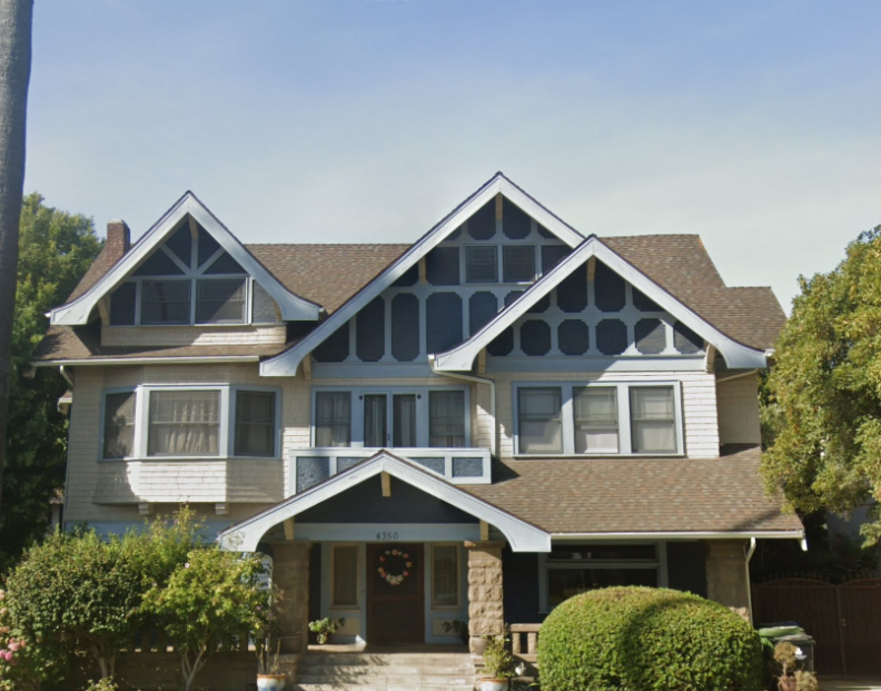 A close up of a Victorian style house during daylight.