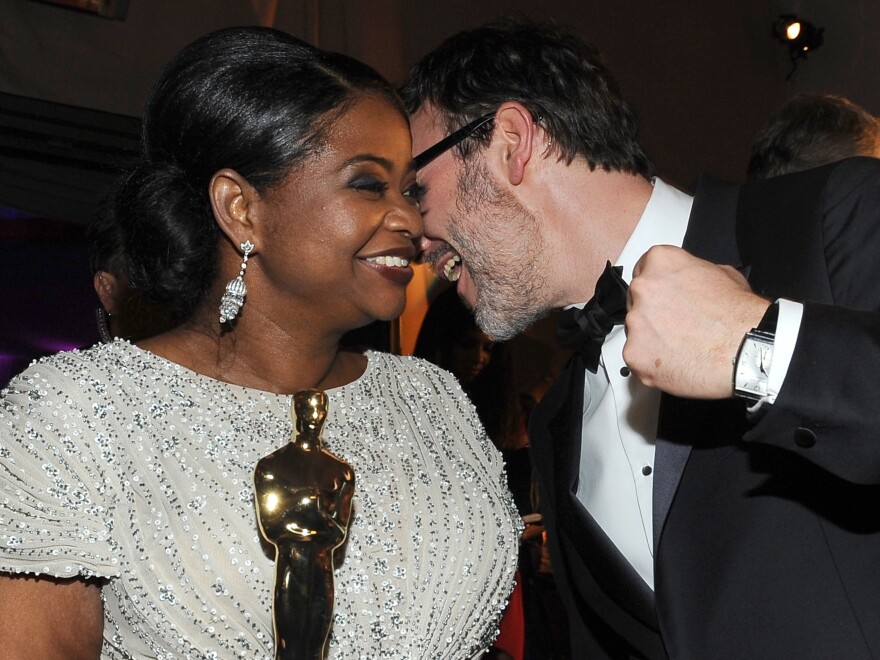 Octavia Spencer (L), winner for Best Actress in a Supporting Role for "The Help," and Michel Hazanavicius (R) winner for Best Writing (Original Screenplay) for "The Artist," share a moment at the Governor's Ball after the 84th Annual Academy Awards  on February 26, 2012 in Hollywood, California. AFP PHOTO/ Valerie Macon (Photo credit should read VALERIE MACON/AFP/Getty Images)
