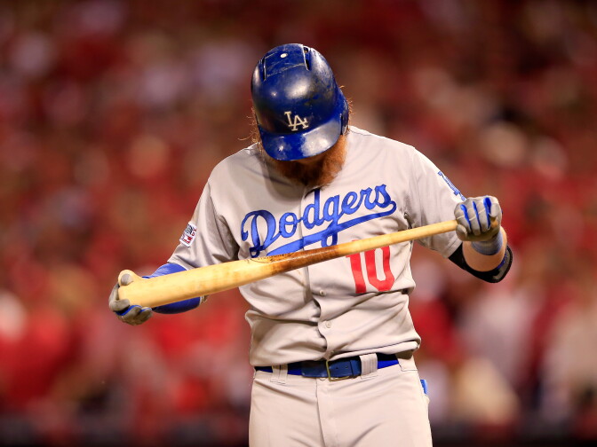 Justin Turner #10 of the Los Angeles Dodgers reacts after striking out in the ninth inning against the St. Louis Cardinals in Game Four of the National League Divison Series at Busch Stadium on Oct. 7, 2014 in St Louis, Missouri.