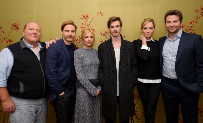 (L-R) Mario Batali, Daniel Bruhl, Sienna Miller, Sam Keeley, Uma Thurman and Bradley Cooper attend the "BURNT" New York Press Conference at The London Hotel on October 20, 2015 in New York City.  