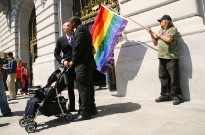 Rodney Maccarate and James Winstead kiss after exchanging vows.